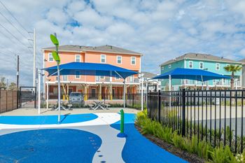 our apartments have a playground and a pool in front of our homes